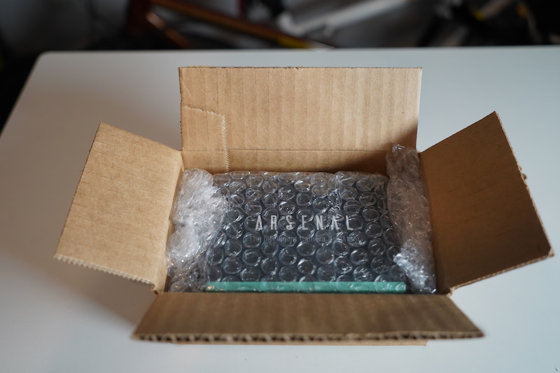 The Arsenal came in a small box with some bubble wrap.