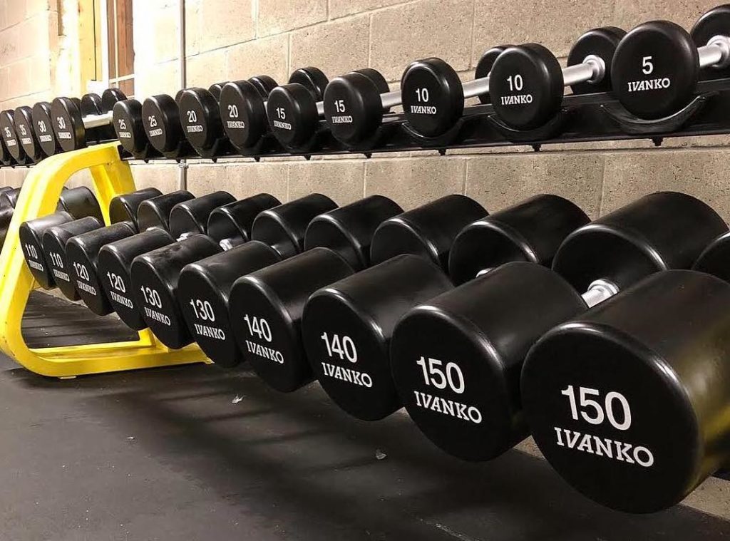 View of Ivanko  Urethane Dumbbells At a Crossfit gym